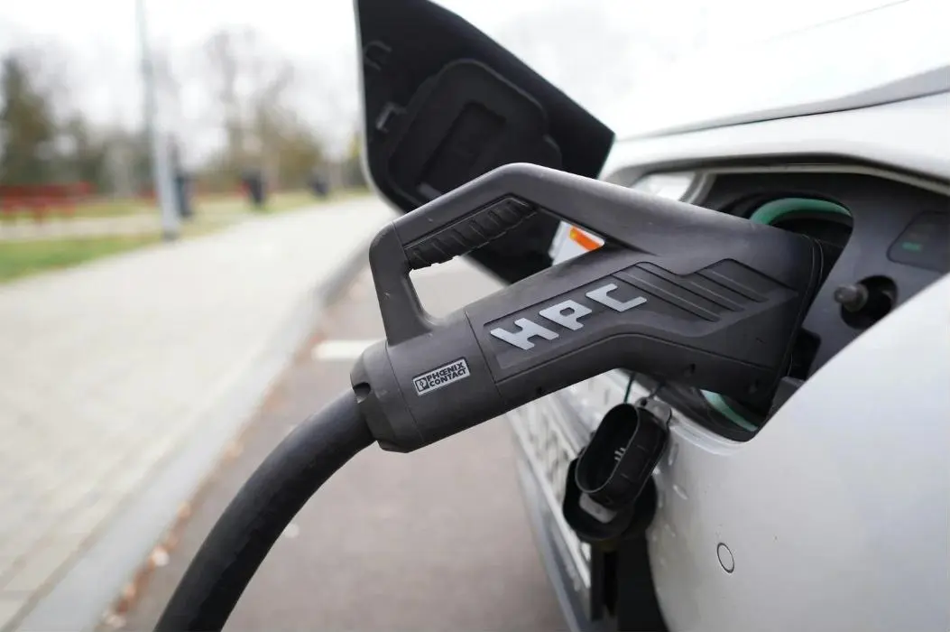 High power charging connector plugged into an EV